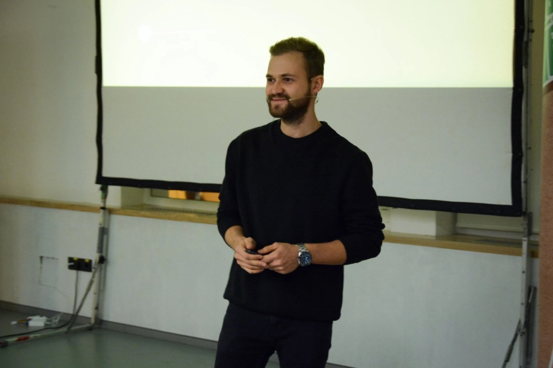 Dima Braven speaking at a presentation